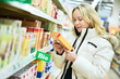 woman making bio food shopping at grocery store