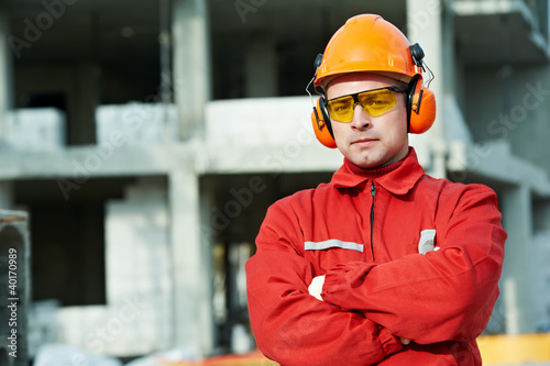 Photo: builder worker at construction site builder worker at construction site