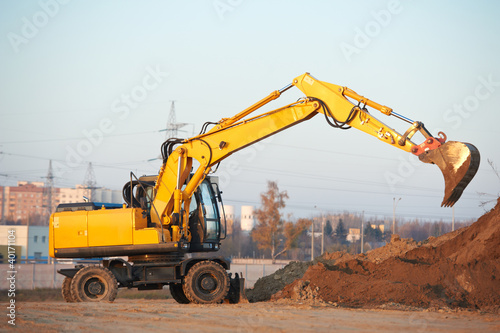 Photo: wheel loader excavator at work wheel loader excavator at work