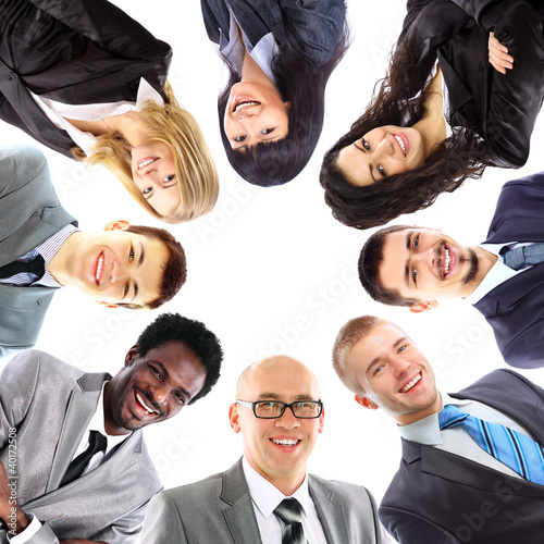 Photo: Group of business people standing in huddle Group of business people standing in huddle