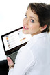 Closeup portrait of a young woman using laptop
