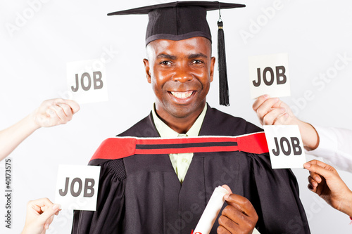 Photo: happy african graduate with job offers happy african graduate with job offers