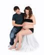 loving couple admiring womans bare pregnant belly. isolated