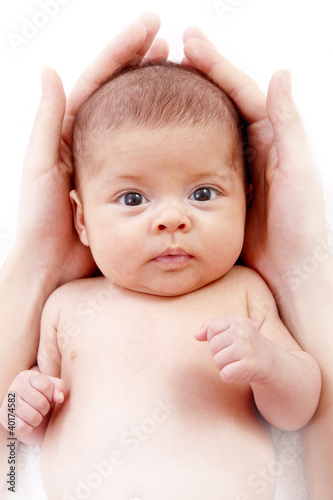 Photo: baby protected by mother's hands baby protected by mother's hands