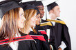 group of graduates looking away at graduation