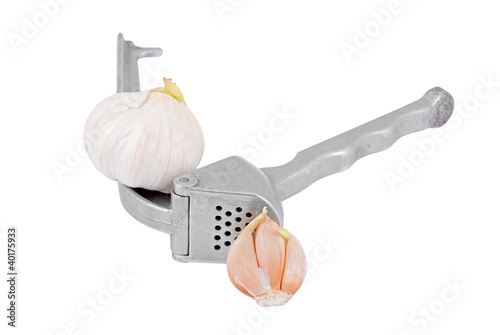 Photo: Garlic press and garlic, isolated on white background Garlic press and garlic, isolated on white background