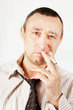 Photo: Sleazy man with a cigarette Sleazy man with a cigarette