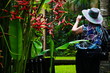 Foto: young girl tourist with camera on white young girl tourist with camera on white