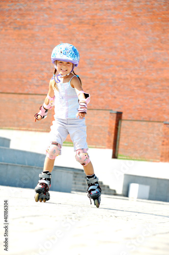 Photo: child on inline rollerblade skates child on inline rollerblade skates