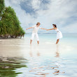 Young couple on the beach of sea