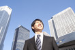 Foto: A building and a young businessman A building and a young businessman