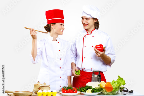 Foto: Portrait of a young cook in uniform Portrait of a young cook in uniform
