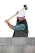 Mason smashing wall