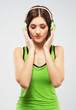 Young woman listening a music in headphones