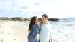 Couple of lovers walking on the beach