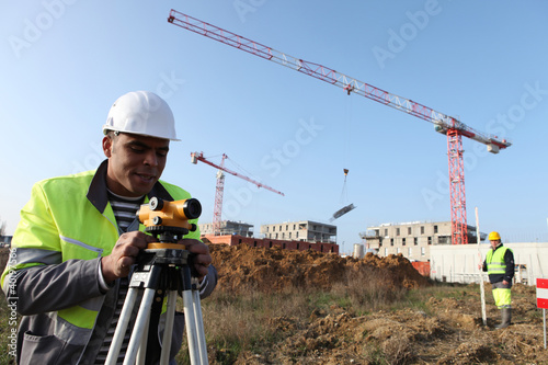 Photo: A land surveyor using an altometer A land surveyor using an altometer