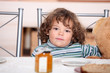 Young child waiting to eat breakfast