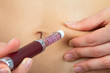 Photo: Diabetes patient make insulin injection shot by syringe in abdom Diabetes patient make insulin injection shot by syringe in abdom