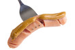 Wiener with mustard on the fork, isolated on white
