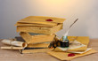 old books, scrolls, feather pen and inkwell old books, scrolls, feather pen and inkwell