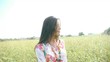 Attractive woman standing in country field