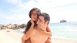 Man giving piggyback ride to girlfriend
