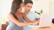 COuple at home purchasing on internet