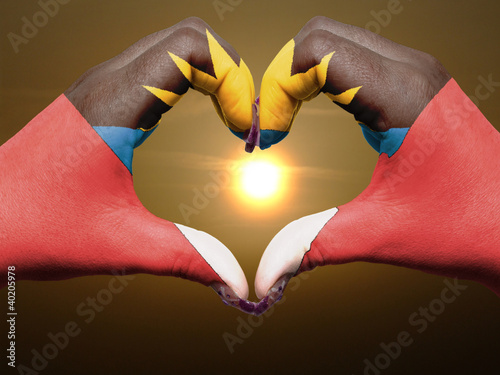 Photo: Heart and love gesture by hands colored in antigua barbuda flag Heart and love gesture by hands colored in antigua barbuda flag