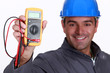 Electrician holding voltmeter