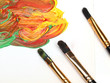 Three brushes and strokes over white