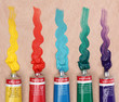 Five paint tubes over a pallete