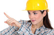 Female construction worker pointing her finger