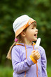 girl with ice cream looks away