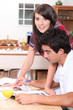Young couple in kitchen before work