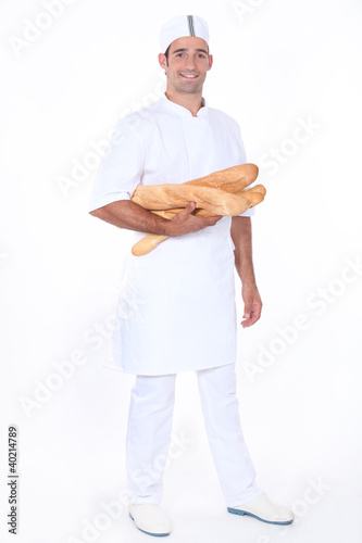 Photo: Baker with loaves of bread Baker with loaves of bread