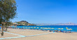 sea bay with sand beach and parasols