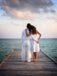 Photo: Sensual happy couple in white clothes on a pier (Maldives) Sensual happy couple in white clothes on a pier (Maldives)