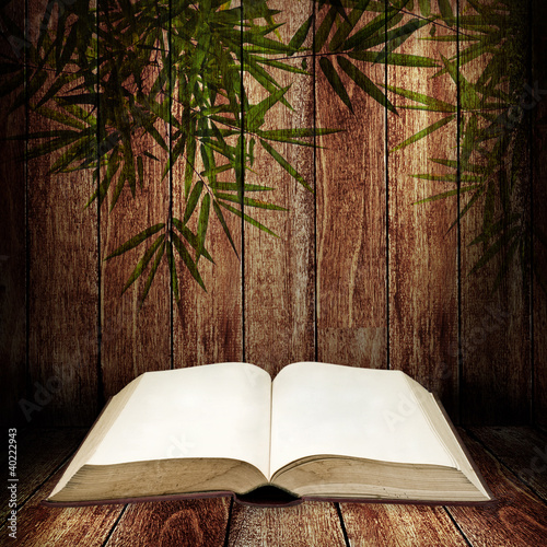 Photo: Open book on wooden table Open book on wooden table