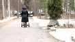 Baby in a stroller, someone pushing