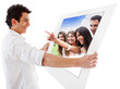 Man holding banner with people