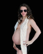 Photo: pregnant woman in sunglasses and scarf exposing bare belly. isol pregnant woman in sunglasses and scarf exposing bare belly. isol