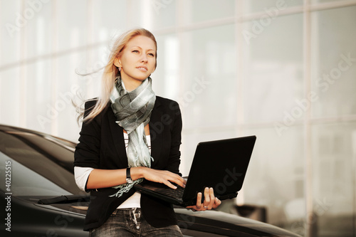Photo: Young businesswoman with laptop Young businesswoman with laptop