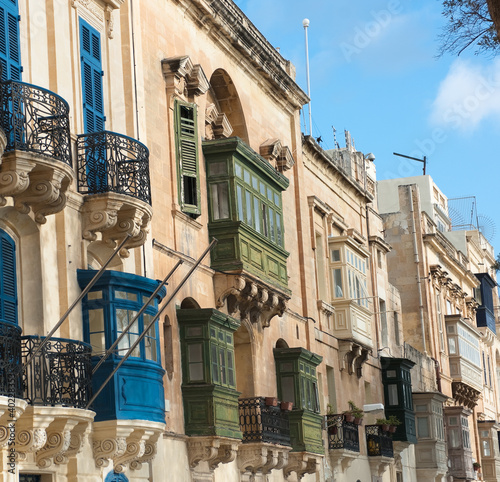 luxury mansions baroque style with the traditional balconies wooden in a Valletta street, Malta