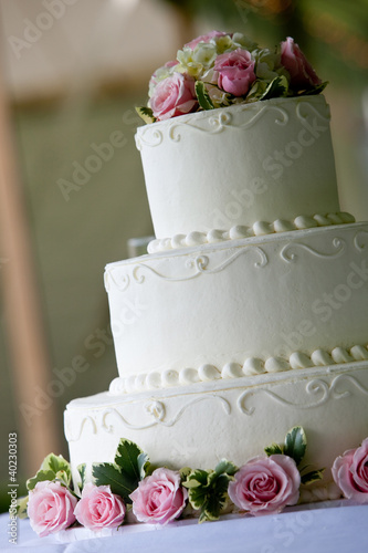 Photo: White wedding cake with pink flowers White wedding cake with pink flowers