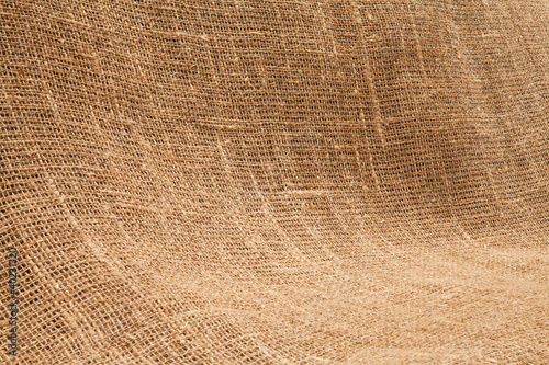 Photo: Close-up of natural burlap hessian sacking. Background texture u Close-up of natural burlap hessian sacking. Background texture u