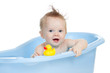 adorable baby having bath in blue tub