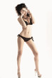 sensual and cute girl in swimsuit portrayed in full-length