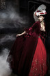 Beautiful woman wearing red dress over a train