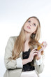 Photo: Happy young woman holding a golden credit card Happy young woman holding a golden credit card