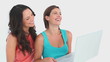 Two girls using a laptop